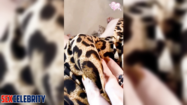 Margot Robbie is rock hard and tugging it in a sexy leopard print dress