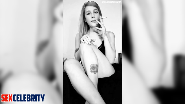 Adult Eden McCoy showed off her natural tits while smoking a cigarette