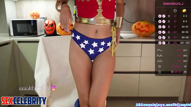 Brunette in superhero suit drinking wine on webcamera, fake Emma Watson